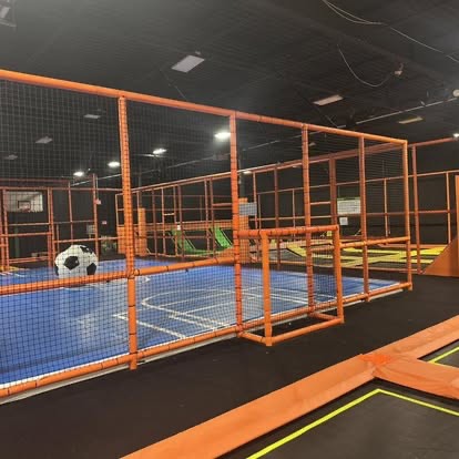 Blue indoor court used for basketball and soccer