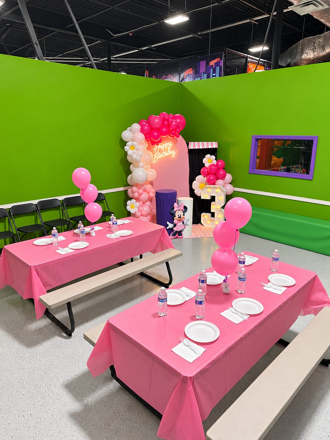Minnie Mouse birthday setup at FunZ Westfield with a pink balloon arch, a number 3 and pink tables